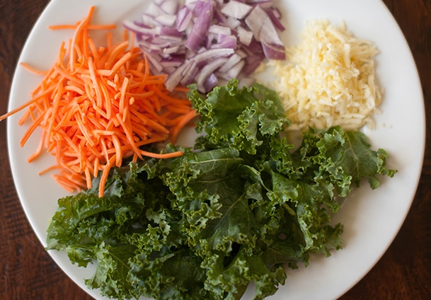 1. Grab a bunch of the kale and slice it into thin ribbons. Add the cut kale to a large bowl.