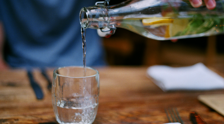 Pouring water into a glass