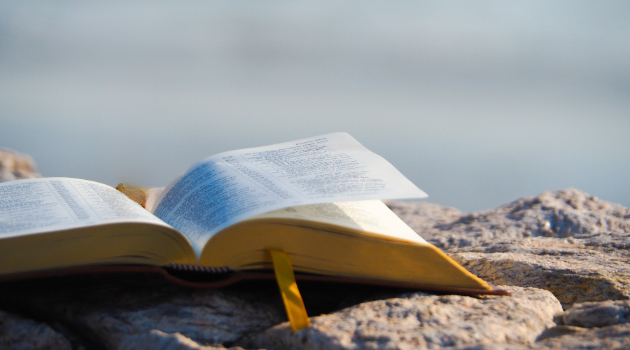 Bible open near water
