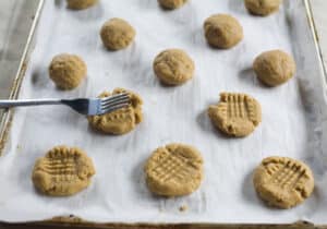 Place peanut butter cookies on cookie sheet