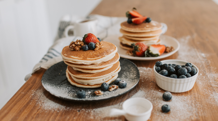 two plates of pancakes made nutty with einkorn ancient grains