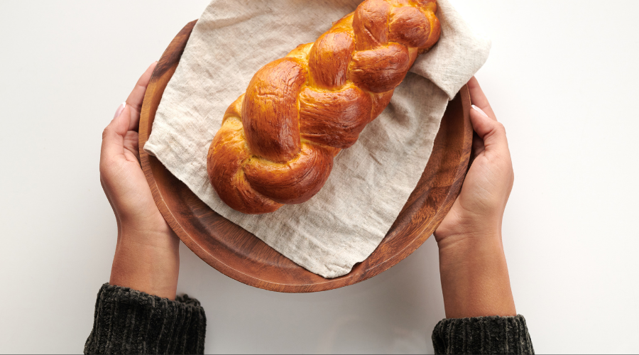 A Loaf of Challah Bread Being Served